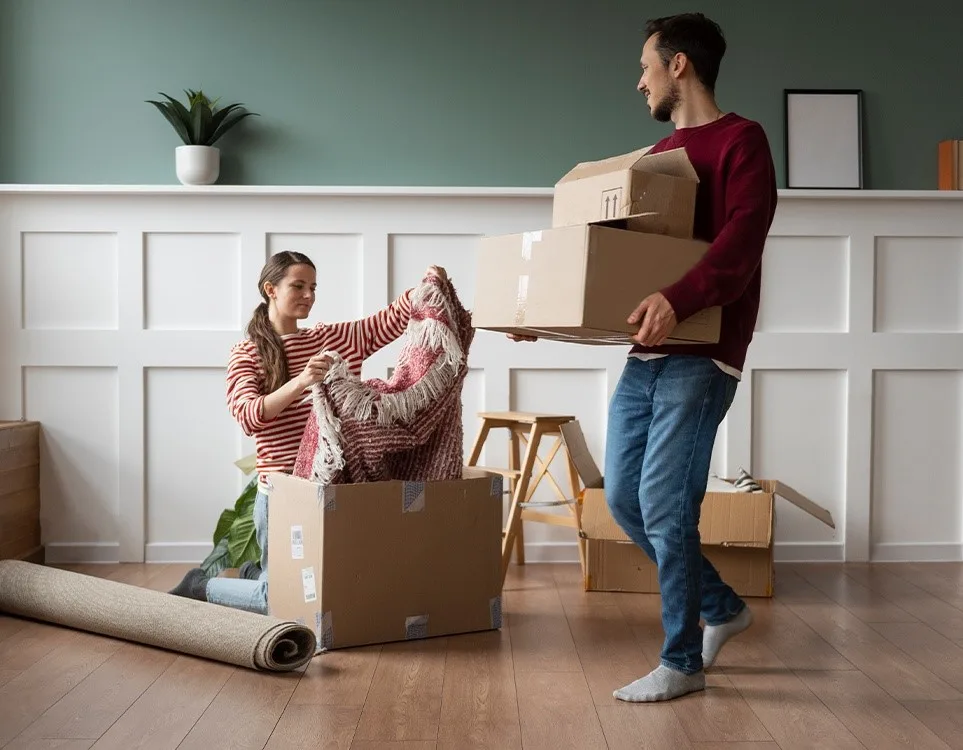Couple unpacking boxes